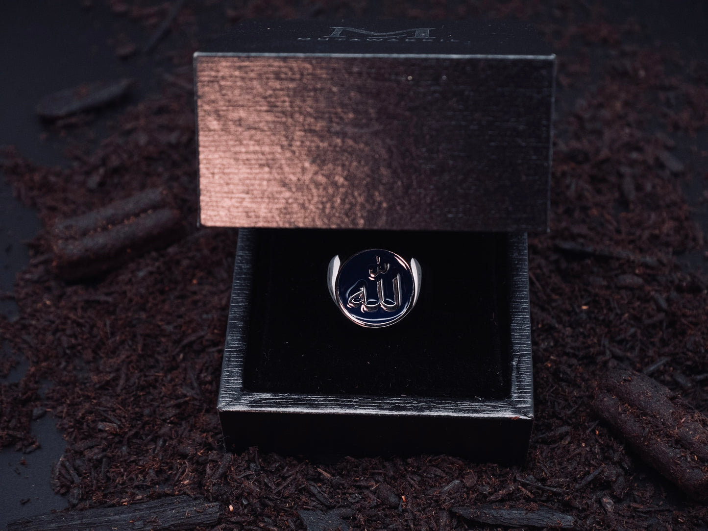Mutawakkil Sabr blue Islamic ring engraved with Allah in Arabic calligraphy, presented in luxury black gift box.